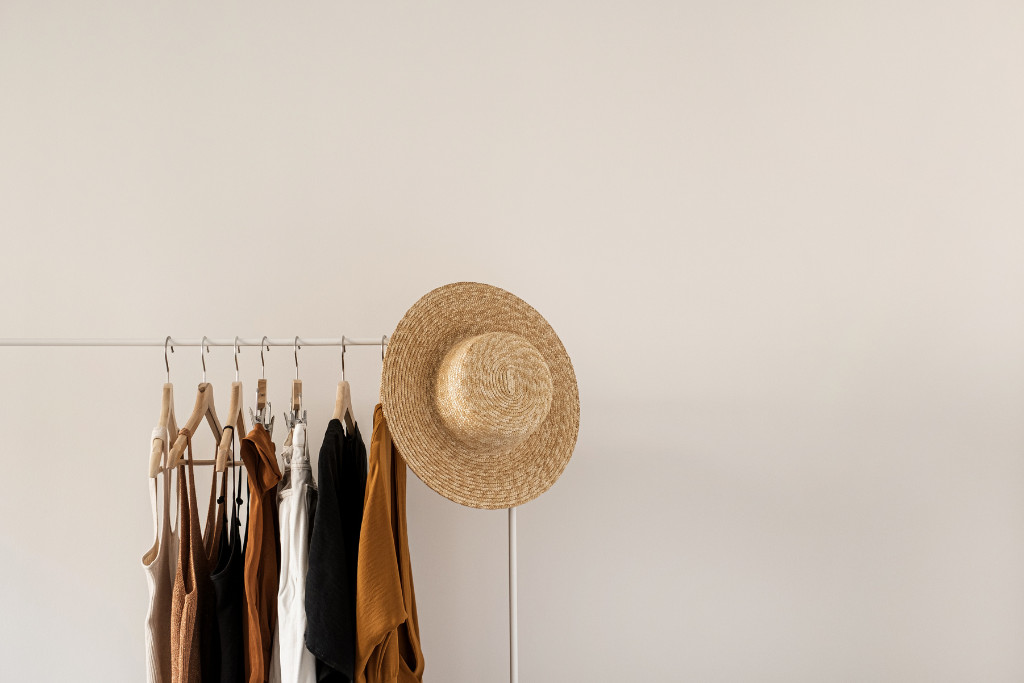 hanging clothes with brown hat